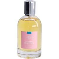 Clear glass bottle with silver cap, pink label, containing yellow Jasmin Dentelle Eau de Toilette by Comptoir Sud Pacifique.