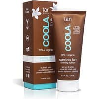 Brown tube of Coola Gradual Tan Firming Lotion with white text and matching box featuring floral design.