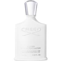 White Creed Silver Mountain Water bottle with silver cap, embossed logo, and elegant minimalist design.