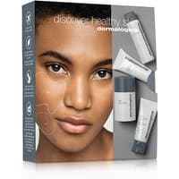Dermalogica face kit with cleanser, toner, and moisturizer in white tubes, packaged in a sleek gray box.