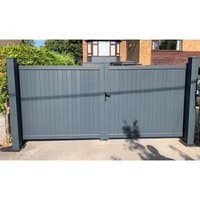 Grey Devon Premium metal driveway double gates with vertical slats and central lock, framed by sturdy posts.