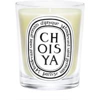 Clear glass Diptyque Choisya floral candle, white wax, black text logo on front, 190g size.