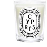 Clear glass jar with white wax, featuring "Cypres" label in black text by Diptyque, 190g woody scented candle.