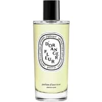 Clear glass bottle of Diptyque Fleur d'Oranger room spray with black cap and white oval label.