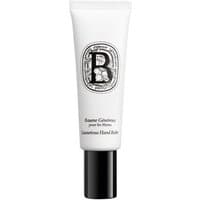 White Diptyque hand balm tube with black cap, ornate logo, and elegant script text, 50 ml size.