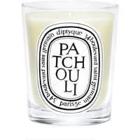 Diptyque Patchouli candle in clear glass jar with black and white label, 190g size.