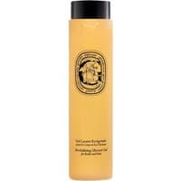 Amber bottle of Diptyque Revitalizing Shower Gel, 200 ml, with black text and ornate oval label.