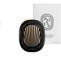 Black and gold Diptyque car diffuser with slatted design, accompanied by white box labeled "Roses."