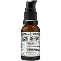 Brown bottle with black pump, labeled "Ecooking Acne Serum," featuring white and black text design.
