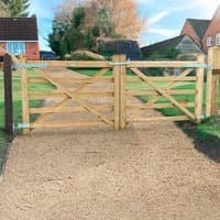 Wooden Croft Prestige gate, 5'x4', natural finish, diagonal cross-bracing, metal hinges, set in a garden path.