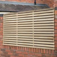 Pressure treated double slatted fence panel, 6' x 3', light wood, horizontal slats, mounted on brick wall.
