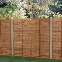 Brown pressure-treated wooden fence panel with horizontal slats, measuring 6' x 5', set against a garden backdrop.
