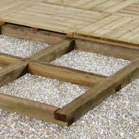 Wooden deck bearer pack, 70mm x 70mm x 2400mm, arranged on gravel, supporting timber decking.