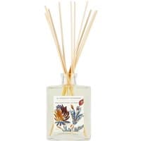 Clear glass diffuser with wooden reeds, floral label, and citrus design by Fragonard.