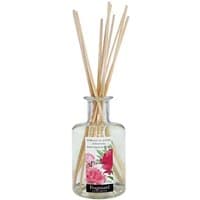 Clear glass diffuser with wooden reeds, featuring a floral label with pink peonies, by Fragonard.
