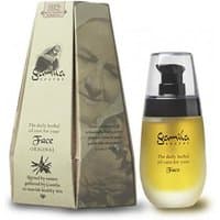 Gamila Secret face oil in a clear bottle with black pump, next to a beige box with brand logo and elderly woman's image.