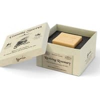 Beige Gamila Secret soap bar in open cream box with black lining, labeled "Reviving Rosemary" for normal skin.