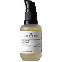 Hobe Pergh face concentrate in a clear bottle with black pump, featuring herbs and hay extract label, 30 ml size.