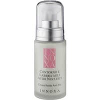 White Innoxa anti-aging eye cream bottle with pink label, clear cap, and pump dispenser, 30 ml size.