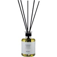 Clear glass bottle with yellow liquid, black reeds, and white label for Laboratorio Olfattivo Agrumeto Citrus Diffuser.