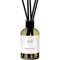 Clear glass diffuser bottle with black reeds, white label reading "Laboratorio Olfattivo Arancio in Fiore," 500 ml size.