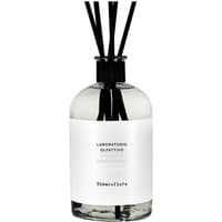 Clear glass diffuser bottle with black reeds and white label, "Laboratorio Olfattivo Biancofiore 1000 ml" text.