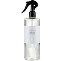 Clear bottle with black spray nozzle, white label reading "Laboratorio Olfattivo - Cuore d'Ambra Room Spray 500 ml".