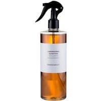 Amber bottle of Laboratorio Olfattivo Distillato 17 woody room spray with black spray nozzle and white label.