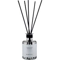 Clear glass diffuser bottle with black reeds, silver cap, and white label reading "Laboratorio Olfattivo - MeloMirtillo."