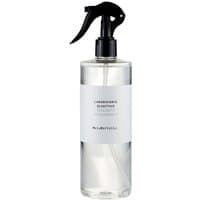 Clear bottle of Laboratorio Olfattivo MeloMirtillo Room Spray with black spray nozzle and white label.