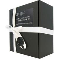 Black Lumi RADICCHIO Men Hair Kit box with white ribbon and wax seal, nourishing kit for all hair types.
