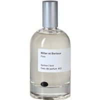 Clear glass bottle with silver cap, white label reading "Miller et Bertaux Spiritus/Land Eau de Parfum #2" unisex spicy perfume.