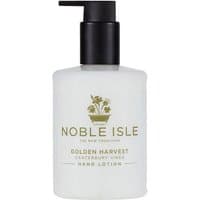 Noble Isle Golden Harvest Hand Lotion, 250 ml, white bottle with black pump and gold logo.
