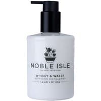 White Noble Isle hand lotion bottle with black pump, featuring "Whisky & Water" label and floral emblem.