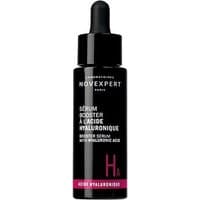 Black Novexpert serum bottle with dropper, white text, pink accent, labeled "Serum Booster a l'Acide Hyaluronique 30 ml."