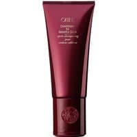 Burgundy Oribe conditioner tube with gold text, 200 ml, for dry, dyed, and bleached hair, embossed cap.