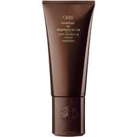 Brown Oribe conditioner tube, 200 ml, with gold text, designed for volume and styling for all hair types.