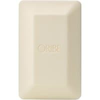 Cream-colored rectangular Oribe bar soap with embossed logo, smooth surface, 200 g.