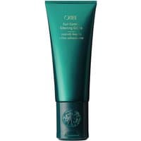 Teal Oribe Curl Control Silkening Crème tube, 147 ml, with gold text and embossed cap design.