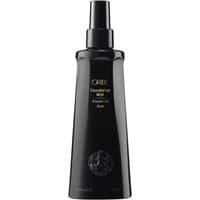 Black Oribe Foundation Mist bottle, 200 ml, with gold text and lion emblem, sleek design for volume and styling.