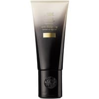 Oribe Gold Lust Conditioner 200 ml in a sleek black and gold gradient tube with a black cap and embossed logo.