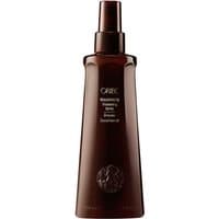 Brown Oribe Maximista Thickening Spray bottle, sleek design, with spray nozzle and white text on front, 200 ml size.