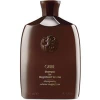 Dark brown Oribe shampoo bottle with embossed logo, gold text, and a flat cap, 250 ml size for volumizing hair.