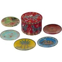 Red Ortigia tin with leopard design, surrounded by five colorful glass plates with various patterns.