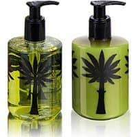 Ortigia Fico d'India body cream and liquid soap set, green bottles with black palm tree design, 300 ml each.