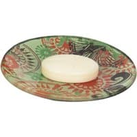 Ortigia Fico d'India soap on a colorful, patterned glass plate with green, red, and black floral designs.