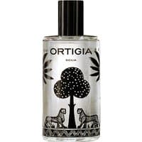 Clear glass bottle with black cap, featuring black palm tree and leopard design, labeled "Ortigia Fico d'India Room Essence."