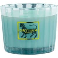 Ortigia Florio floral candle with four wicks, in a ribbed glass container featuring a leopard logo and turquoise wax.