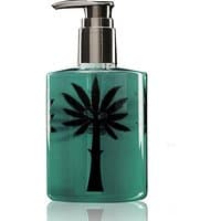 Clear bottle of Ortigia Florio Liquid Soap with black palm tree design and silver pump dispenser.