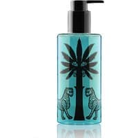 Blue Ortigia Florio shower gel bottle with black pump, palm tree, and leopard design.